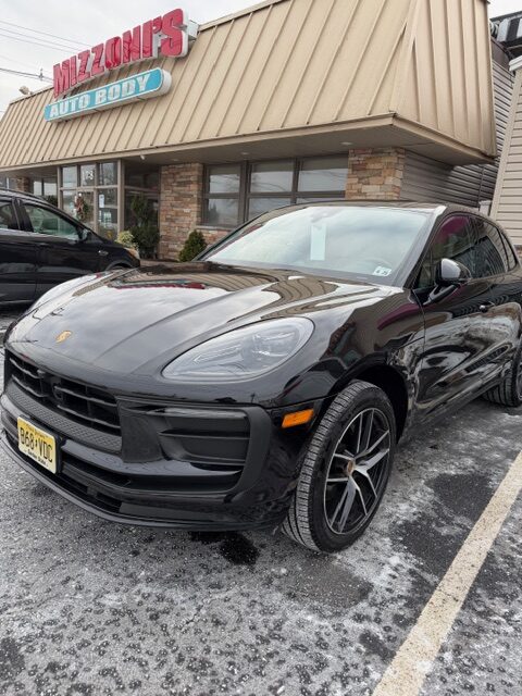 Porsche parked at Mizzonis Body Shop